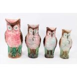 Four majolica owl jugs, polychrome decorated, measuring between 22cm and 28cm high