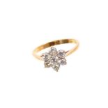 Diamond cluster ring with a flower head cluster of seven brilliant cut diamonds in claw setting on 1