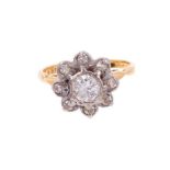 Diamond cluster ring with a flower head cluster of diamonds
