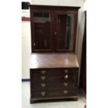 George III mahogany bureau bookcase, the upper section with dentil cornice and enclosed by a pair of