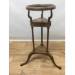 George III mahogany wash stand with dish ring raised over triangular drawer tier, a further tier bel