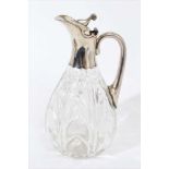 Edwardian silver mounted cut glass claret jug, with leaf pattern decoration.