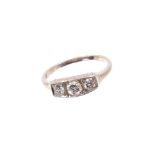 Diamond three stone ring with three old round brilliant cut diamonds in platinum box shape setting o