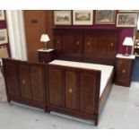 Pair of Edwardian inlaid mahogany single bedsteads, joining to make a super king-size bed, the mould