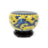 Chinese porcelain bowl with dragon decoration on a yellow ground