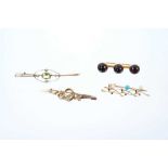 Four Edwardian gold and gem-set bar brooches to include cabochon garnet bar brooch in 15ct gold sett