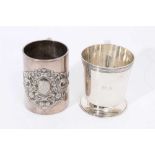 Victorian silver christening mug of cylindrical form with embossed scroll decoration and one other
