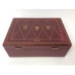 Good quality red leather humidor with tooled gilding and family crests