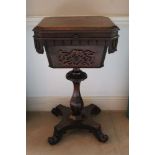 Early Victorian rosewood teapoy with canted rectangular top over a lappet carved frieze and fret car