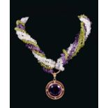 Amethyst, peridot and crystal bead three strand torsade necklace suspending a large amethyst pendant