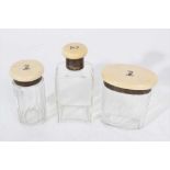 Three ivory lidded glass dressing table jars