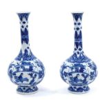 Pair of Chinese blue and white porcelain bottle vases, Kangxi style but 19th/20th century, decorated