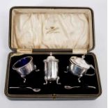 1920s silver three piece condiment set of cauldron form,