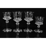 Four William IV glasses with star cut foot