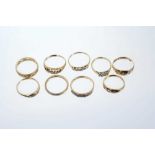 Group of nine gold and diamond set dress rings