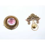 Two Victorian Etruscan Revival gold brooches, one with a large pink foil backed cabochon in circular