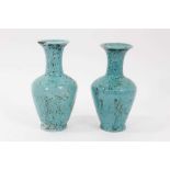 Pair of Iznik turquoise glazed vases
