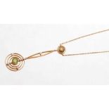 Edwardian peridot and seed pearl 15ct gold target shaped pendant on chain