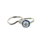 Art Deco style diamond and sapphire halo cluster ring with a round brilliant cut diamond estimated t