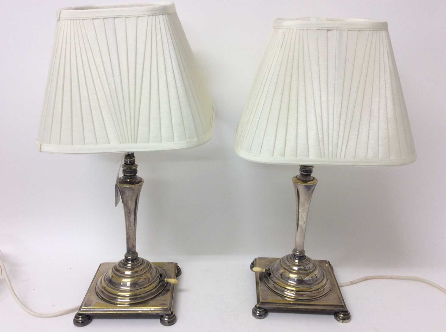 Pair of early 20th century silvered brass table lamps