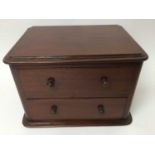 Small 19th century mahogany table top chest of two drawers