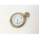 Late 19th century Swiss 18ct gold fob watch with enamel dial in engraved gold case. 32mm diameter.