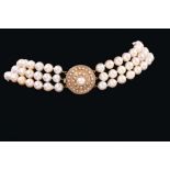 Cultured pearl three-strand choker with three strings of baroque cultured pearls measuring approxima