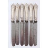 Six Late 19th/early 20th Century German Silver Dinner Knives with steel blades, Rococo pattern handl