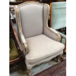 Contemporary armchair with limed show-wood frame, upholstered in grey fabric