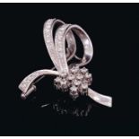 Diamond floral spray brooch with brilliant cut diamonds in 18ct white gold setting. Estimated total