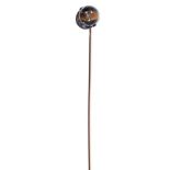 Antique diamond and cat's eye novelty stick pin in the form of a jockey's cap, 11.5mm x 10.2mm.