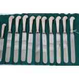 Set of 10 dinner knives and 10 matching dessert knives, with Victorian silver pistol grip handles