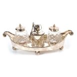 Victorian silver ink stand of boat shaped form, with bead border and scroll ends