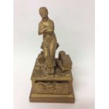 19th century Continental inkstand of classical form depicting figure sitting on tree stump