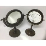 Two Georgian mahogany circular adjustable mirrors