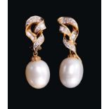 Pair of cultured pearl and diamond pendant earrings, each with a large cultured pearl drop measuring