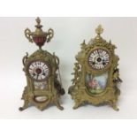 Two late 19th century French gilt metal and porcelain mounted mantel clocks decorated with romantic