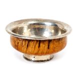 Late 19th/early 20th century Tibetan burlwood tea bowl, with a flared rim and silver lining