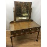 Early 20th century leather covered, painted and walnut dressing table, the Egyptian revival swing mi