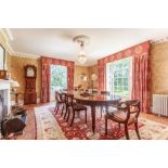 Edwardian mahogany extending D-end dining table with three extra leaves with winding mechanism, on i