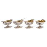 Set of four George III silver salts of compressed campana form, with gilded interiors