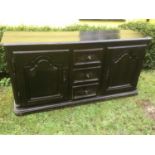 18th century French oak sideboard, with rounded rectangular top, having three central drawers flanke