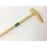 19th century walking cane with Marine ivory shaft, white metal collar and shaped handle.