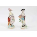 Pair of Derby figures of gardeners, c.1800, emblematic of water and earth, the man holding a spade a