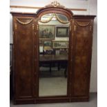 Fine quality early 20th century walnut and gilt heightened triple wardrobe