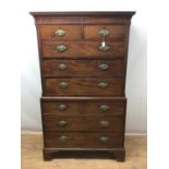 George III mahogany chest on chest with brass oval handles on bracket feet