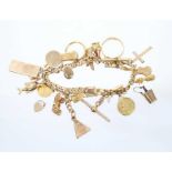 Gold charm bracelet with charms