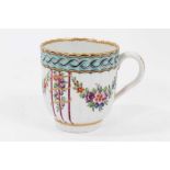 Worcester coffee cup, c.1780, of fluted form, polychrome decorated with floral swags, and a chain li