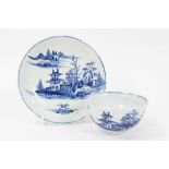 Vauxhall blue and white tea bowl and saucer, c.1755, decorated with an Oriental island pattern, the