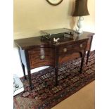 George III mahogany sideboard, the central long drawer and frieze drawer below flanked by concave de